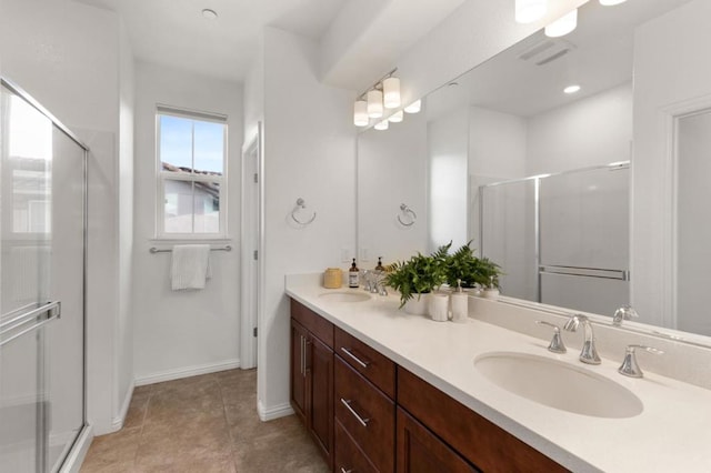 bathroom with walk in shower, tile patterned floors, and vanity