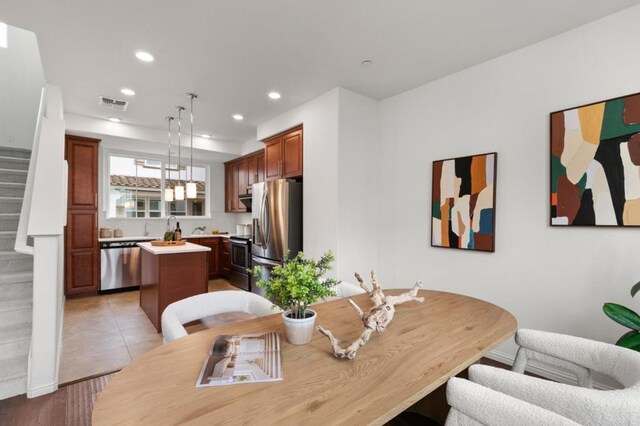 dining area with light tile patterned flooring