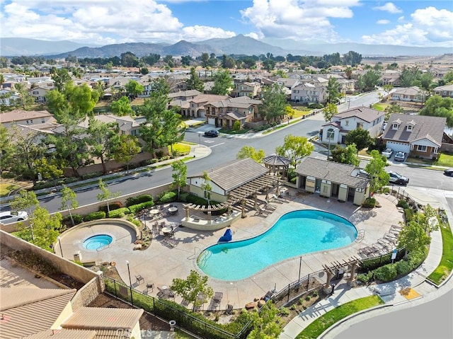 birds eye view of property with a mountain view