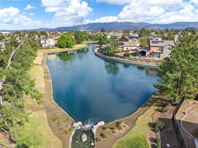 bird's eye view with a water and mountain view