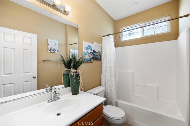 full bathroom featuring vanity, toilet, and shower / bath combo with shower curtain