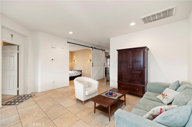 tiled living room featuring a barn door