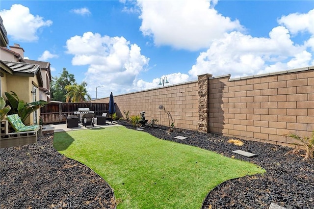 view of yard with a patio area