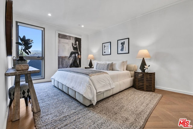 bedroom featuring crown molding, parquet flooring, and access to exterior