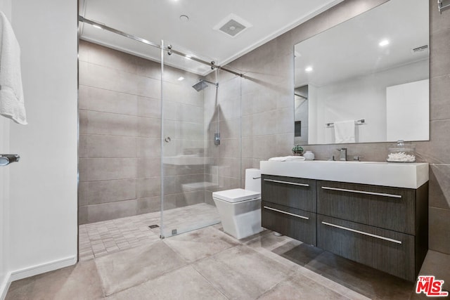 bathroom with tasteful backsplash, tile walls, vanity, toilet, and a shower with door