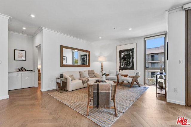 living room with ornamental molding and light parquet floors