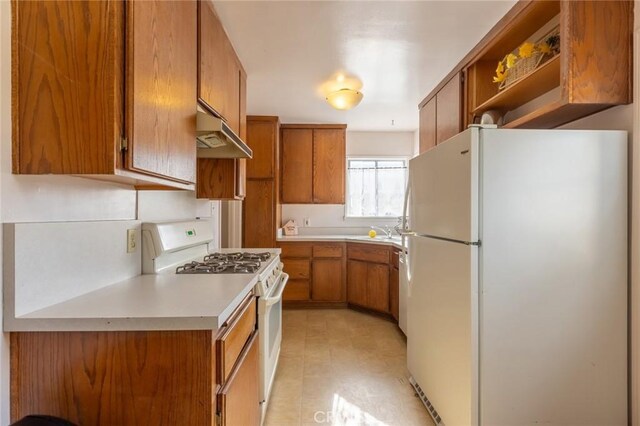 kitchen featuring sink and white appliances