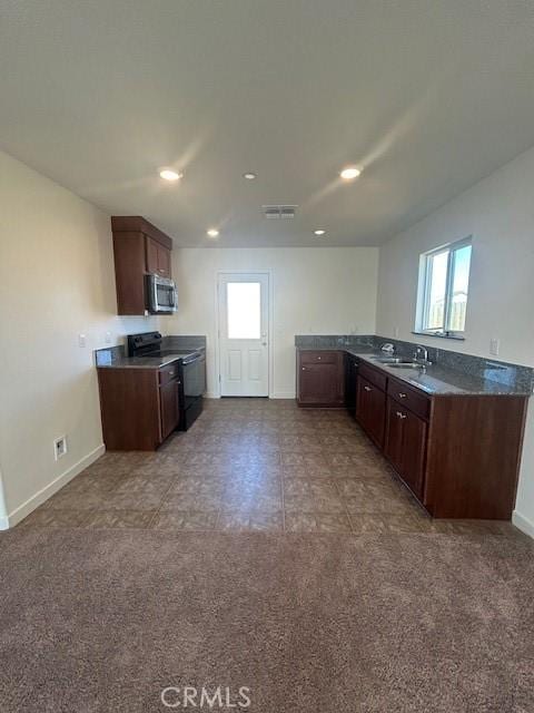 kitchen featuring carpet, sink, dark brown cabinetry, and black range with electric cooktop