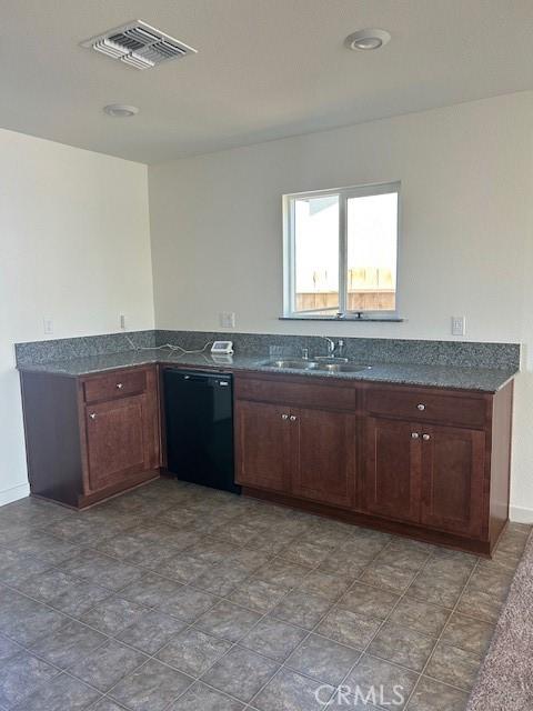 kitchen featuring dishwasher and sink