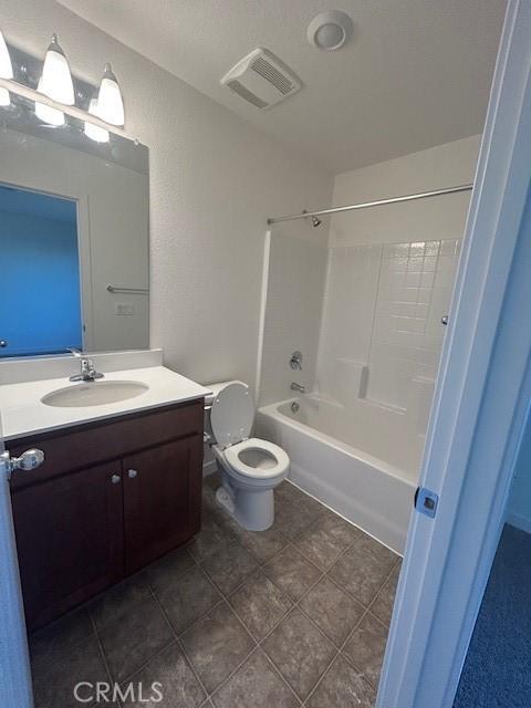 full bathroom with shower / washtub combination, toilet, tile patterned flooring, and vanity