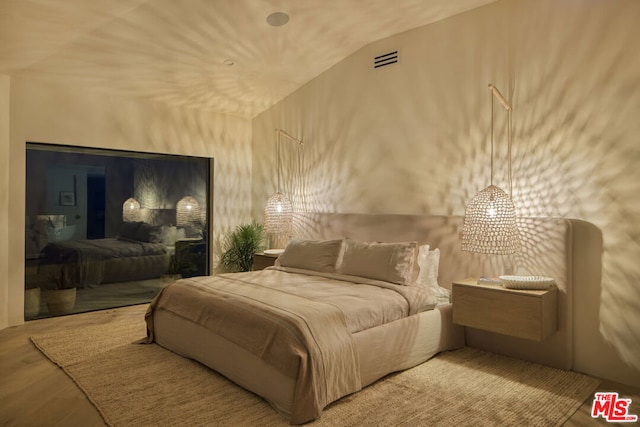 bedroom featuring hardwood / wood-style flooring