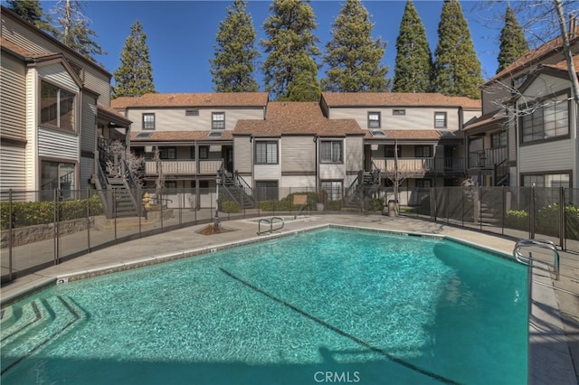 28050 State Highway 189 Unit 212, Lake Arrowhead, CA 92352 - community pool with stairway, a residential view, and a patio area