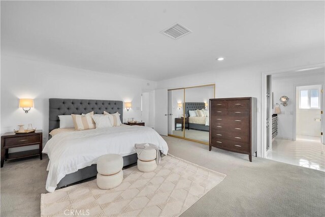 bedroom with light colored carpet