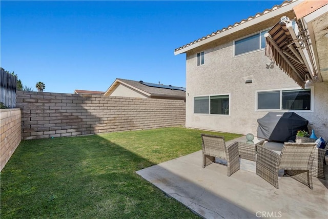 exterior space featuring a yard and a patio area