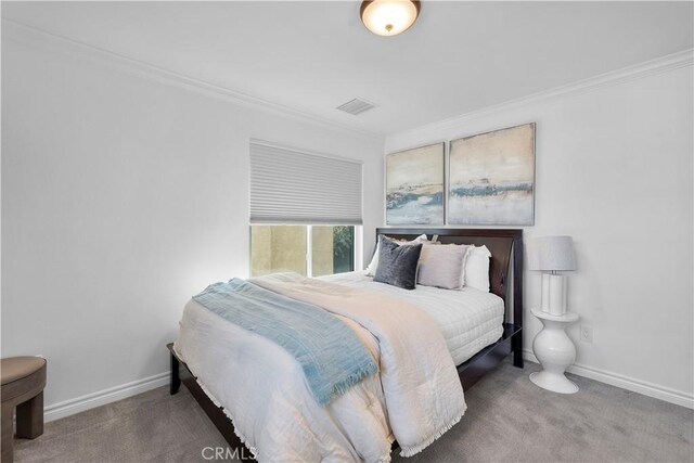 carpeted bedroom featuring ornamental molding