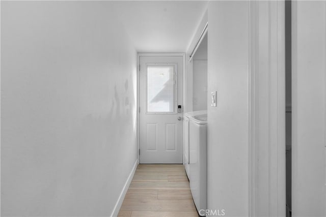 interior space featuring light wood-type flooring and independent washer and dryer