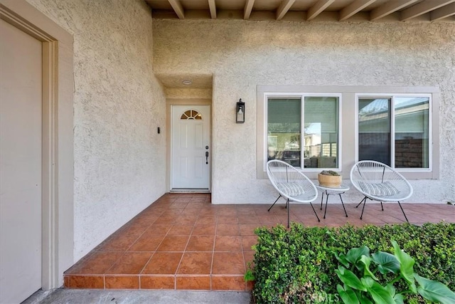 property entrance with a patio area