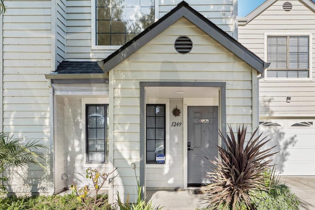 property entrance with a garage