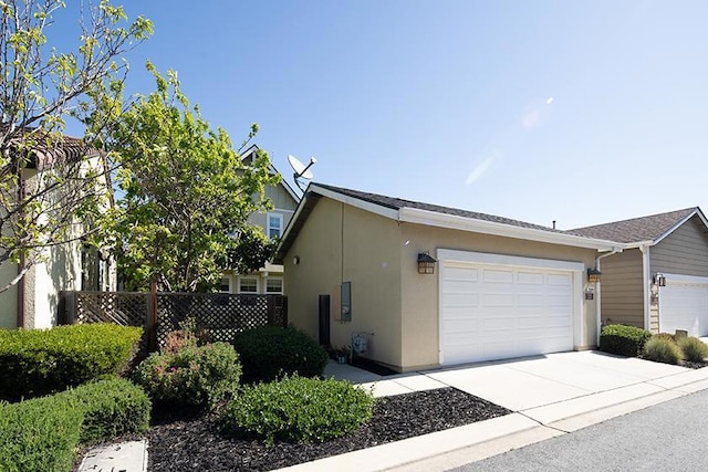 view of side of property with a garage