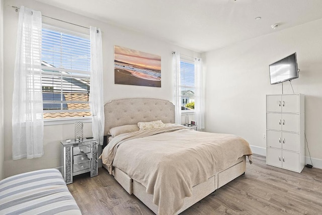 bedroom with hardwood / wood-style floors