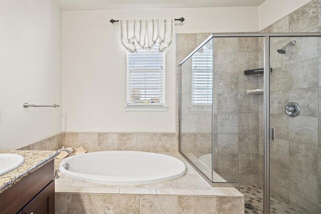 bathroom with vanity and plus walk in shower