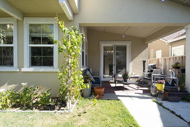 entrance to property with a patio