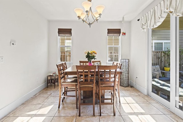 dining space featuring a chandelier and light tile patterned floors