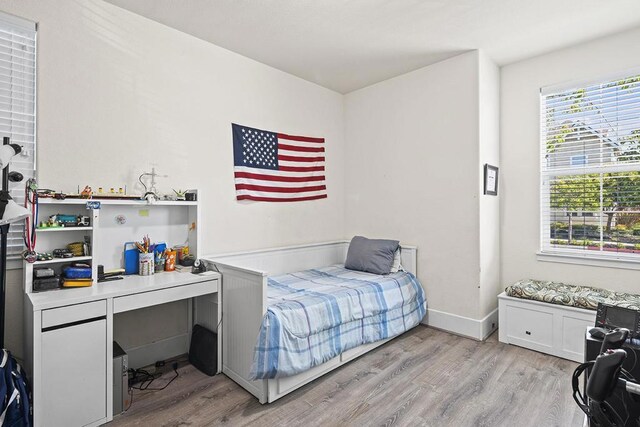 bedroom featuring light hardwood / wood-style floors