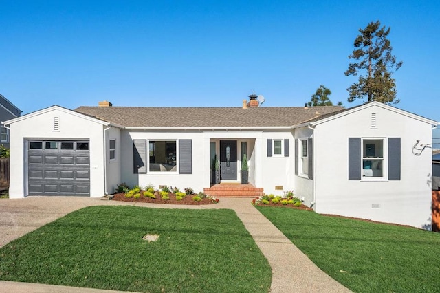 ranch-style house featuring a garage and a front lawn