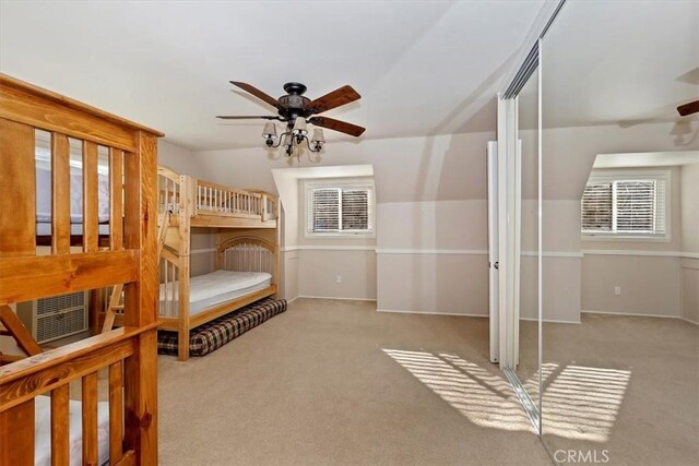 bedroom featuring light carpet