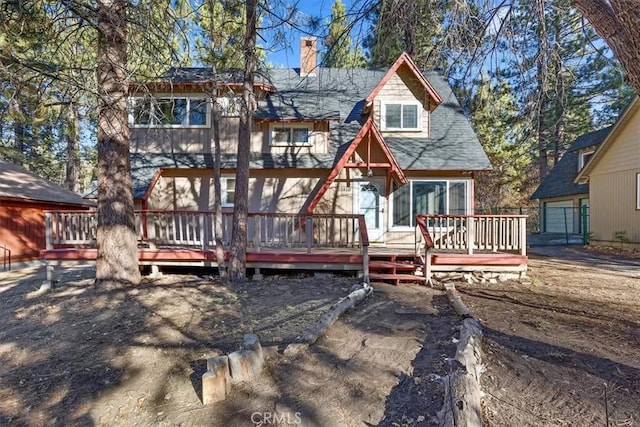 rear view of property with a deck