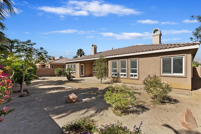 rear view of house with a patio