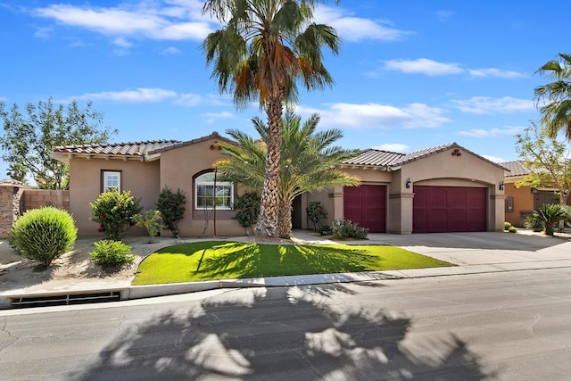 mediterranean / spanish-style home featuring a garage