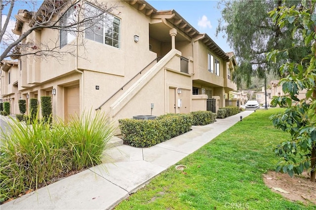 view of side of home featuring a yard