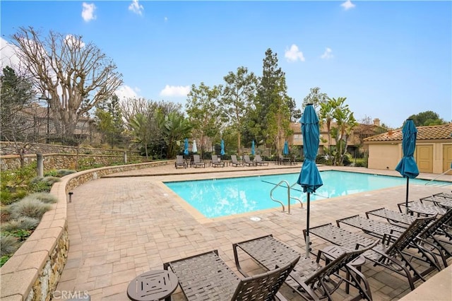 view of pool featuring a patio