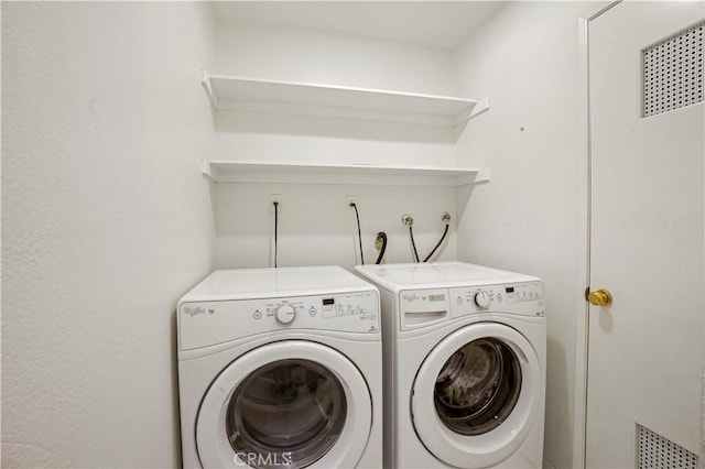 laundry room with washer and dryer