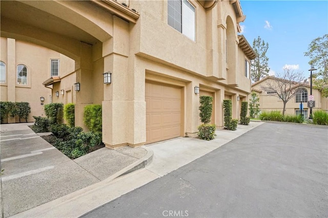 doorway to property with a garage