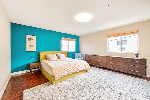 bedroom featuring dark wood-type flooring