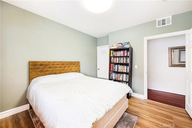 bedroom featuring hardwood / wood-style flooring