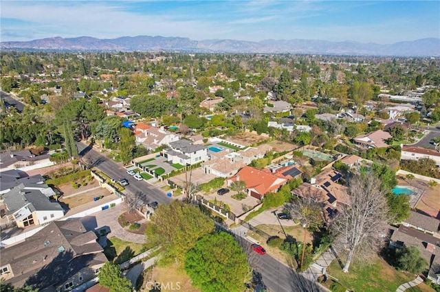 birds eye view of property featuring a mountain view