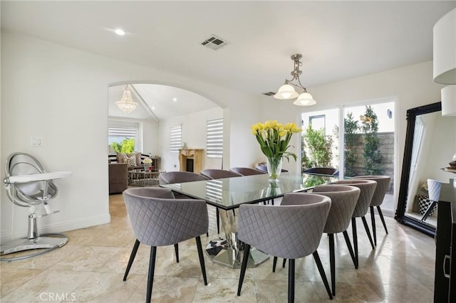 dining room featuring lofted ceiling