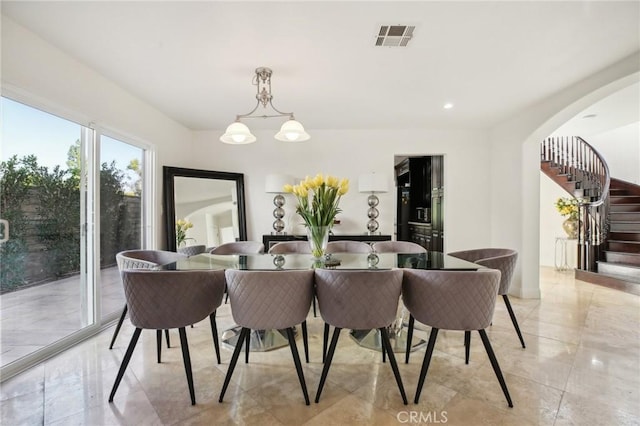 dining space with a chandelier