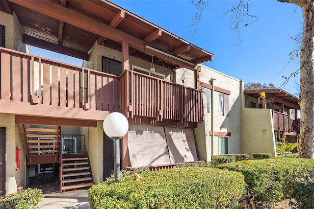 view of home's exterior with a balcony