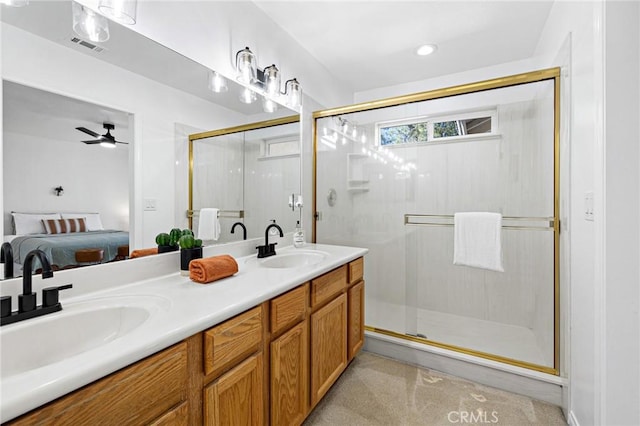 bathroom featuring vanity, ceiling fan, and walk in shower