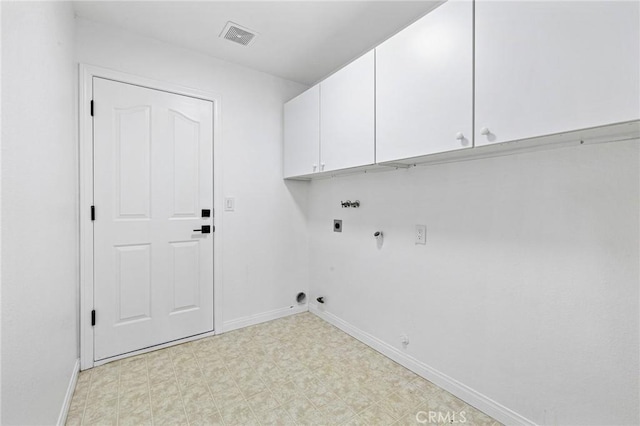 washroom featuring hookup for a gas dryer, electric dryer hookup, washer hookup, and cabinets