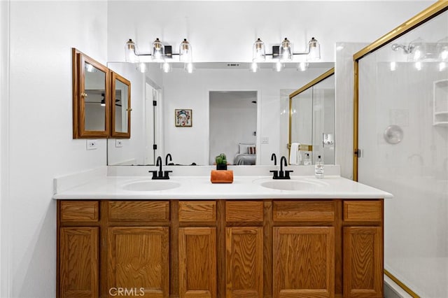 bathroom featuring vanity and a shower with shower door