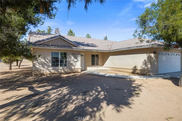 ranch-style house featuring a garage