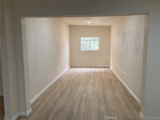 21483 Main St, Barstow, CA 92311 - hallway with light wood-type flooring