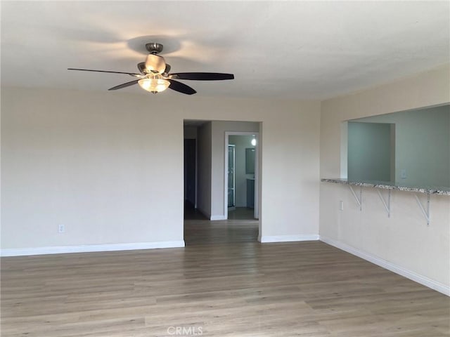 21483 Main St, Barstow, CA 92311 - unfurnished room with hardwood / wood-style floors and ceiling fan