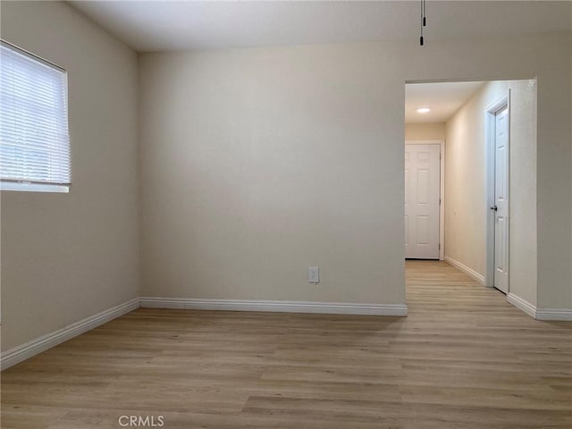 21483 Main St, Barstow, CA 92311 - empty room featuring light hardwood / wood-style flooring